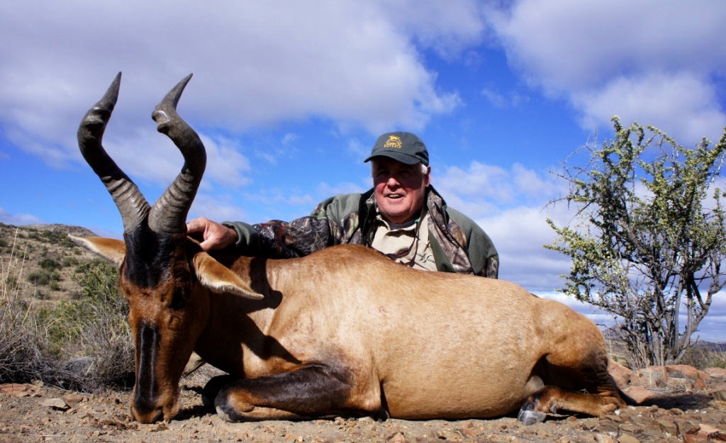The second memorable shot was a Red Hartebeest at 275 yards in a 20 mph wind off the sticks. My thought was frankly "are you crazy to think I can do this?" But I did!