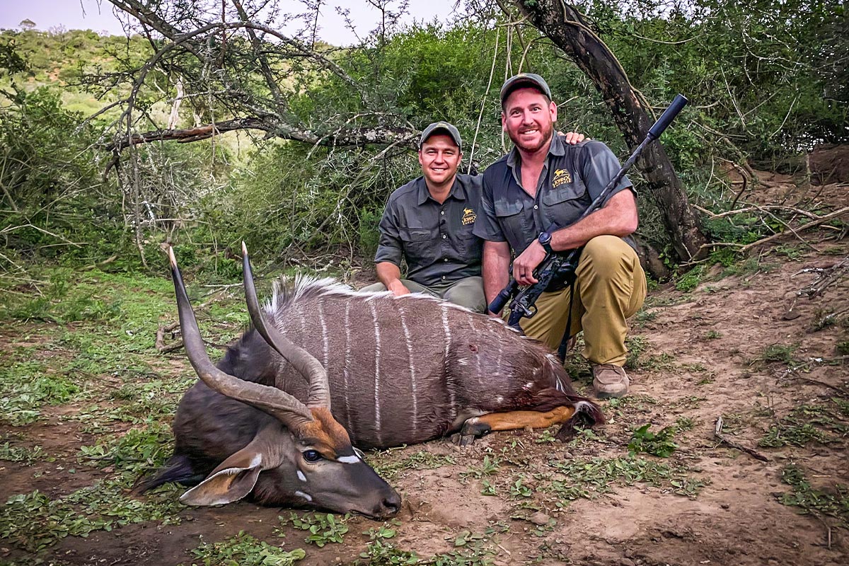 Justin in Africa with John X and Trophy House Taxidermy 1